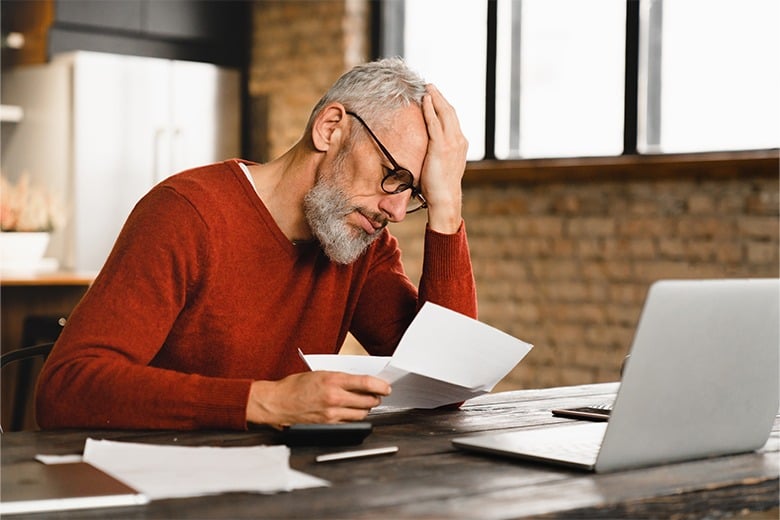 frustrated-man-with-claim-paperwork