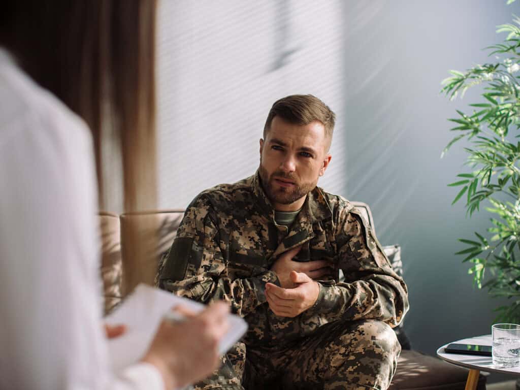 Military veteran getting diagnosed by medical professional